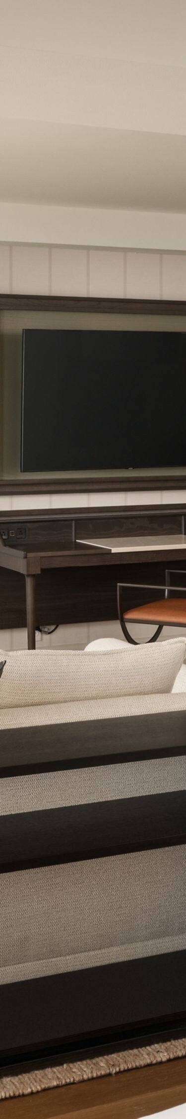 Suite living area with dining table and balcony