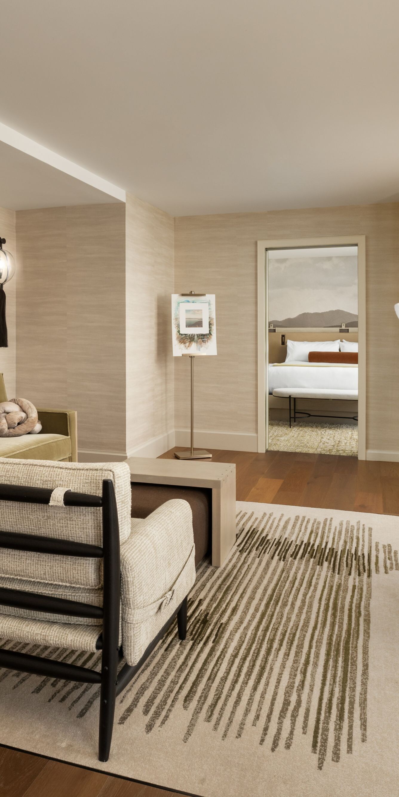 living area with couch, chair, tv, and work desk
