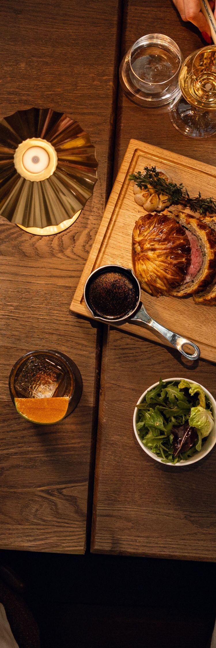 A guest uses chopsticks to pick up a piece of sush