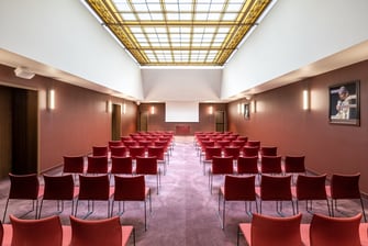 Meeting space, equipped with chairs and tables.