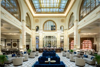 A spacious lobby lounge with a large atrium.