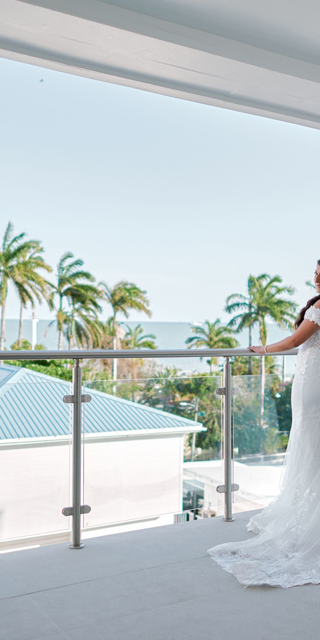 Two persons on balcony with ocean view