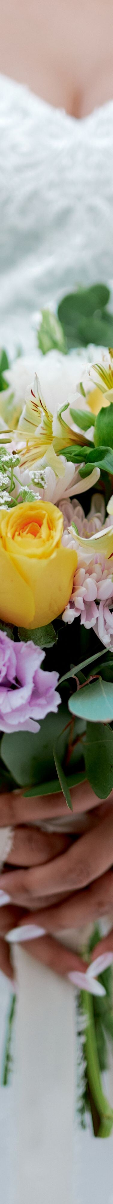 Pastel bouquet held with gown