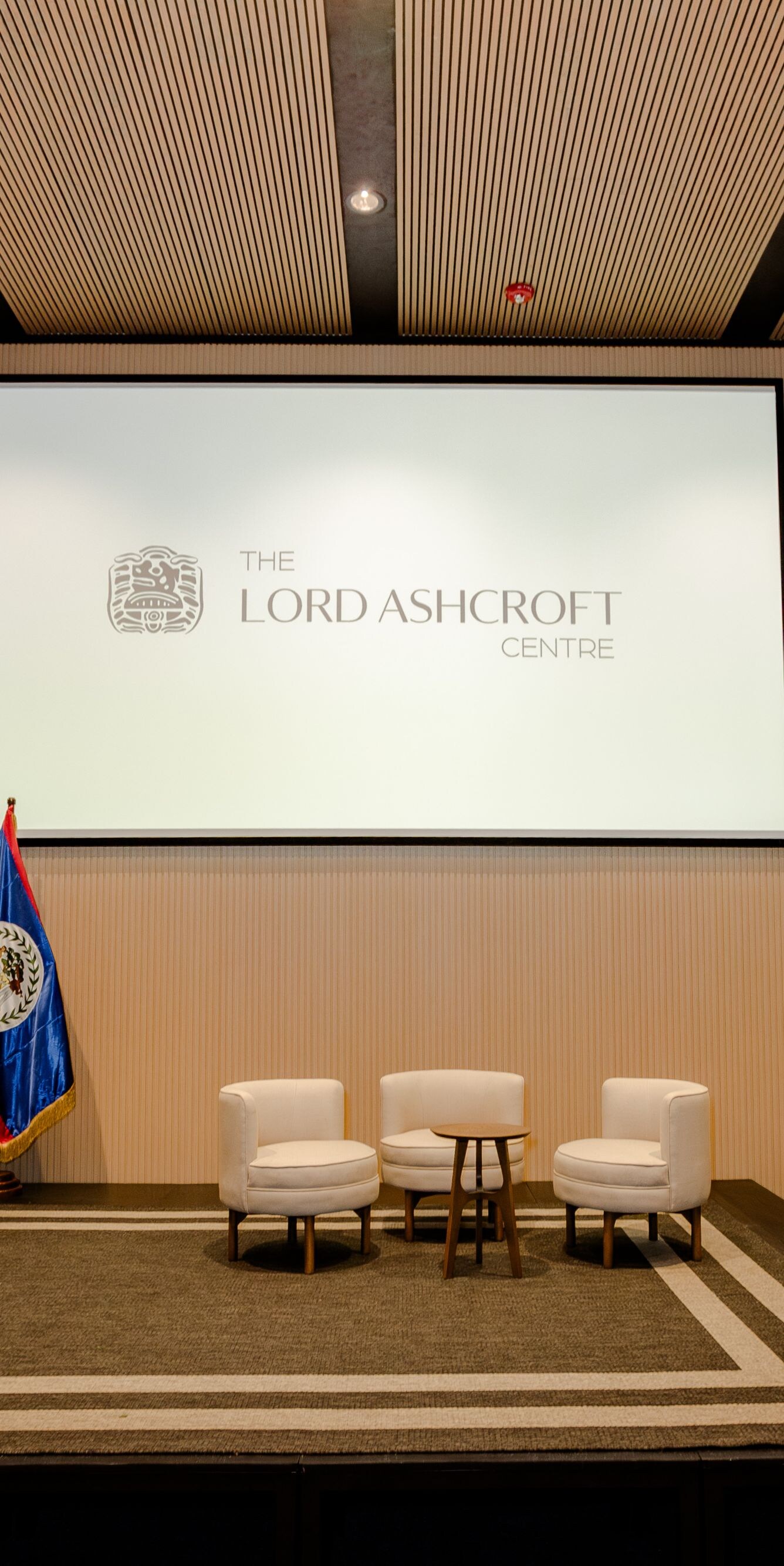 Conference stage with chairs and screen
