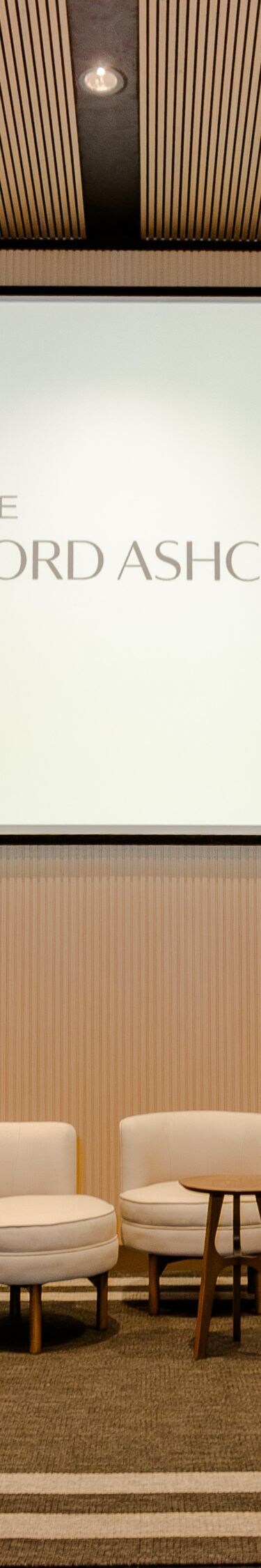 Conference stage with chairs and screen