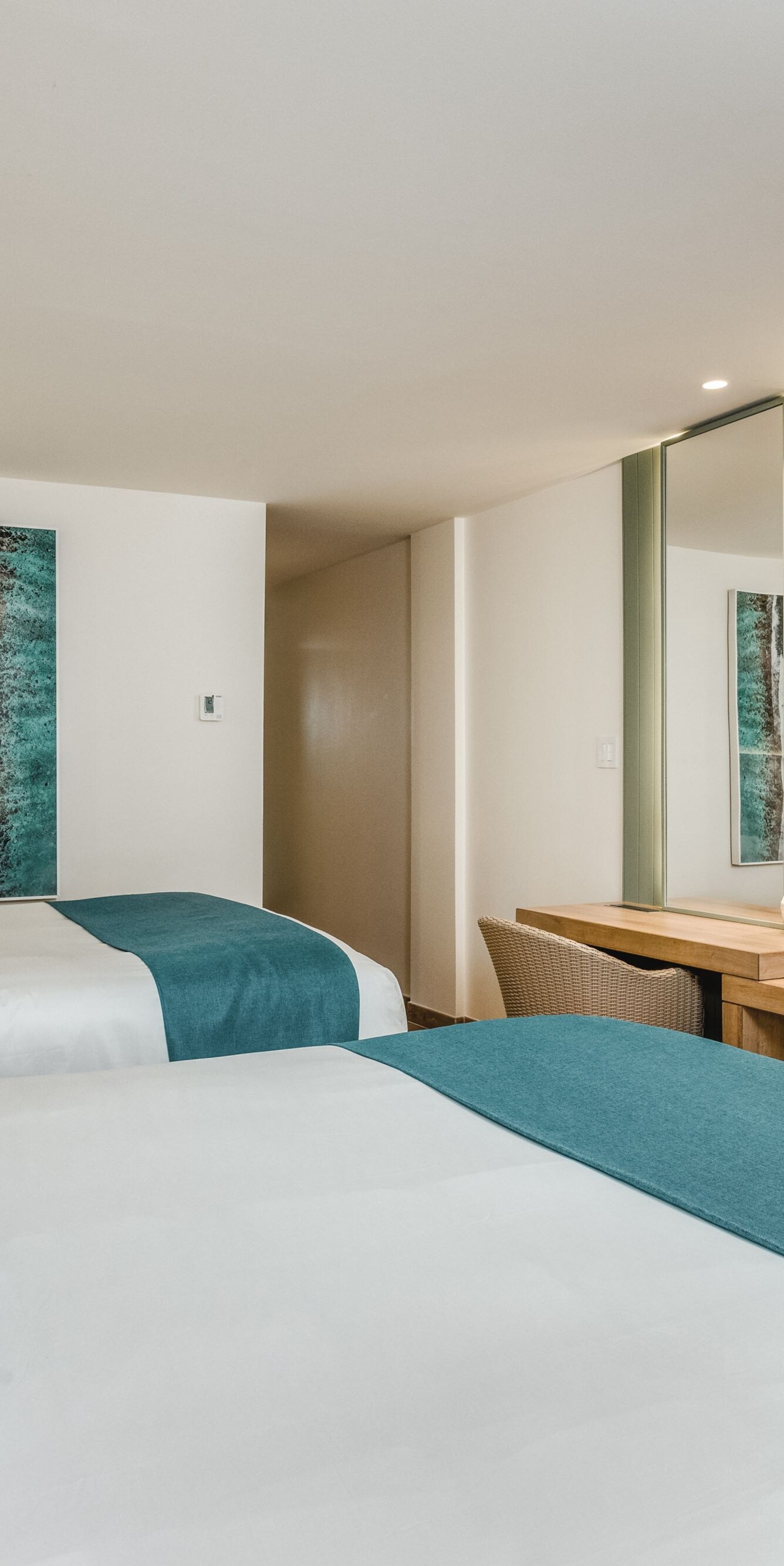 Two queen beds with TV and desk
