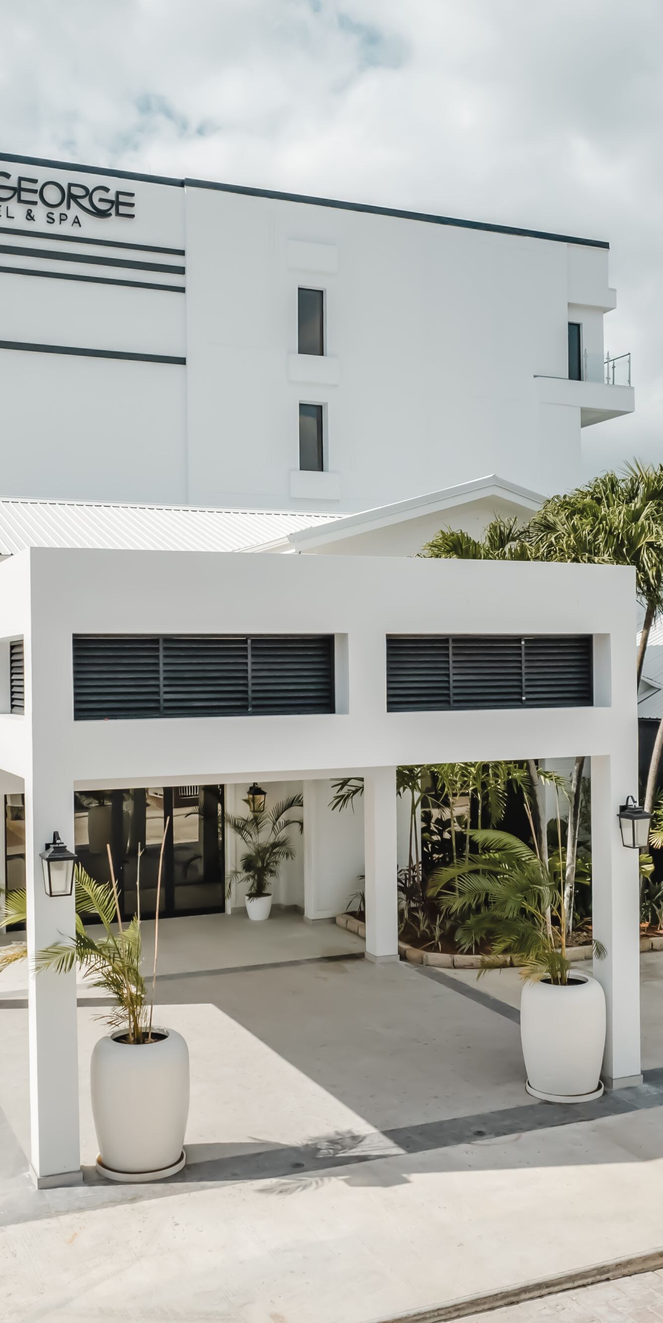 Modern hotel exterior with entrance walkway