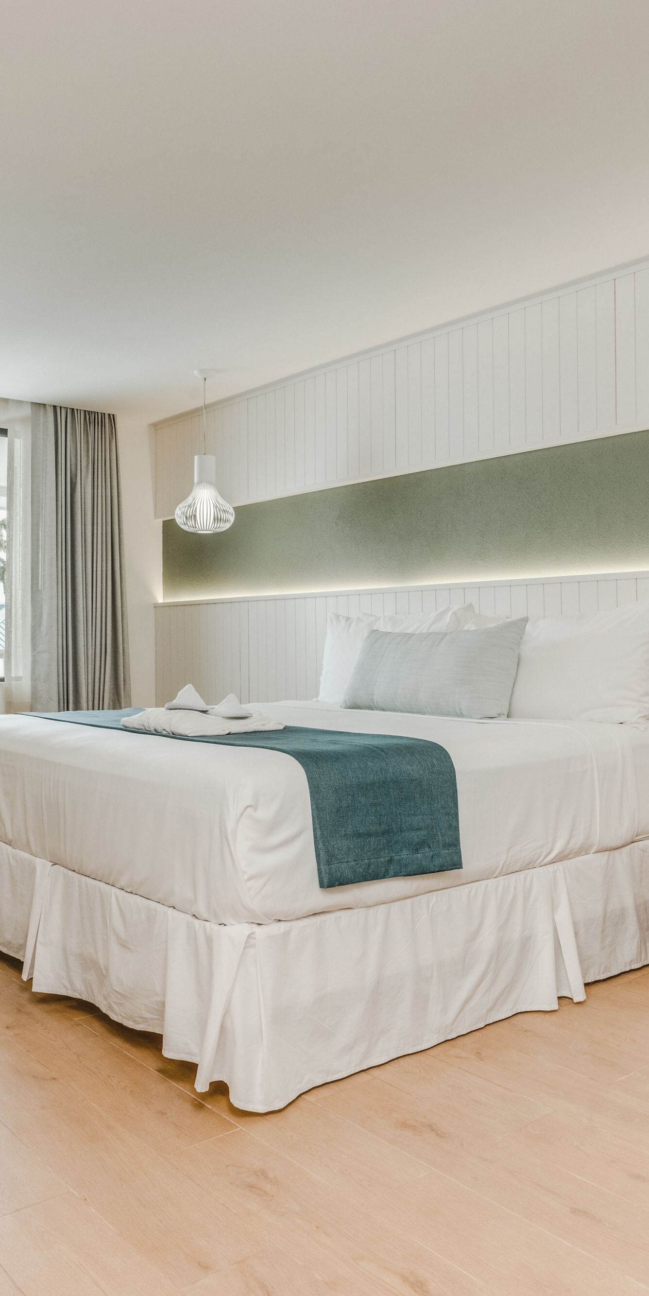 Spacious bedroom with balcony view