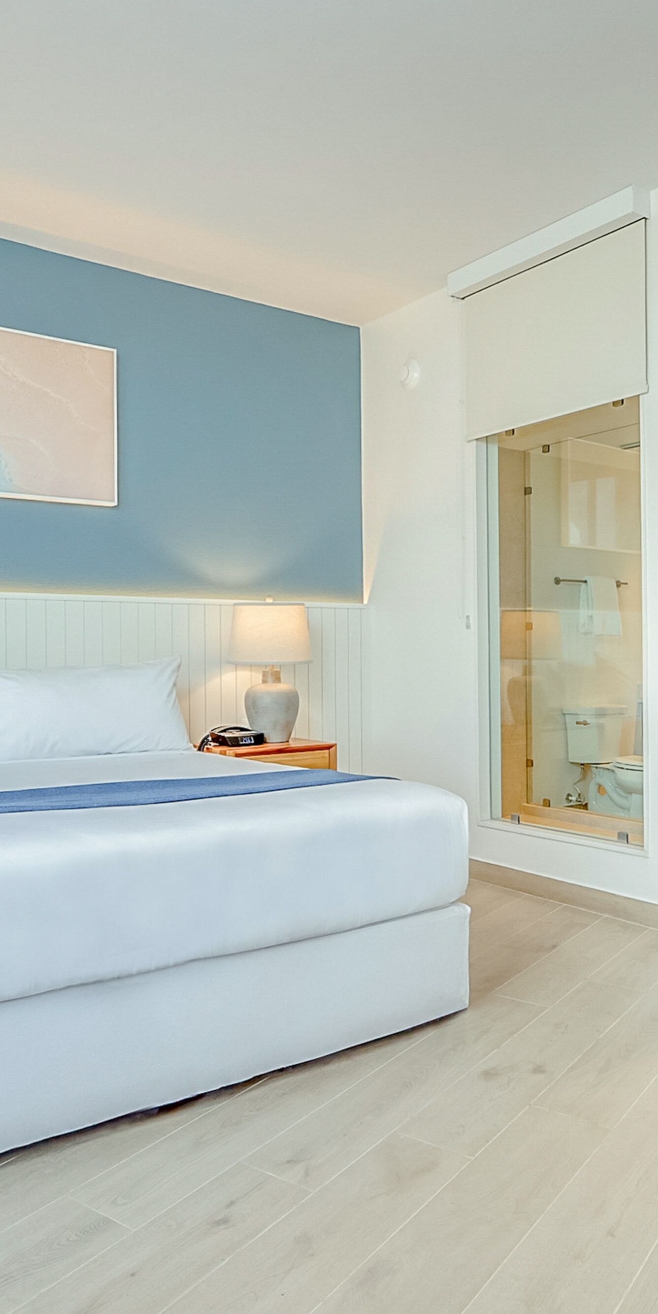 King bed with blue accent wall room