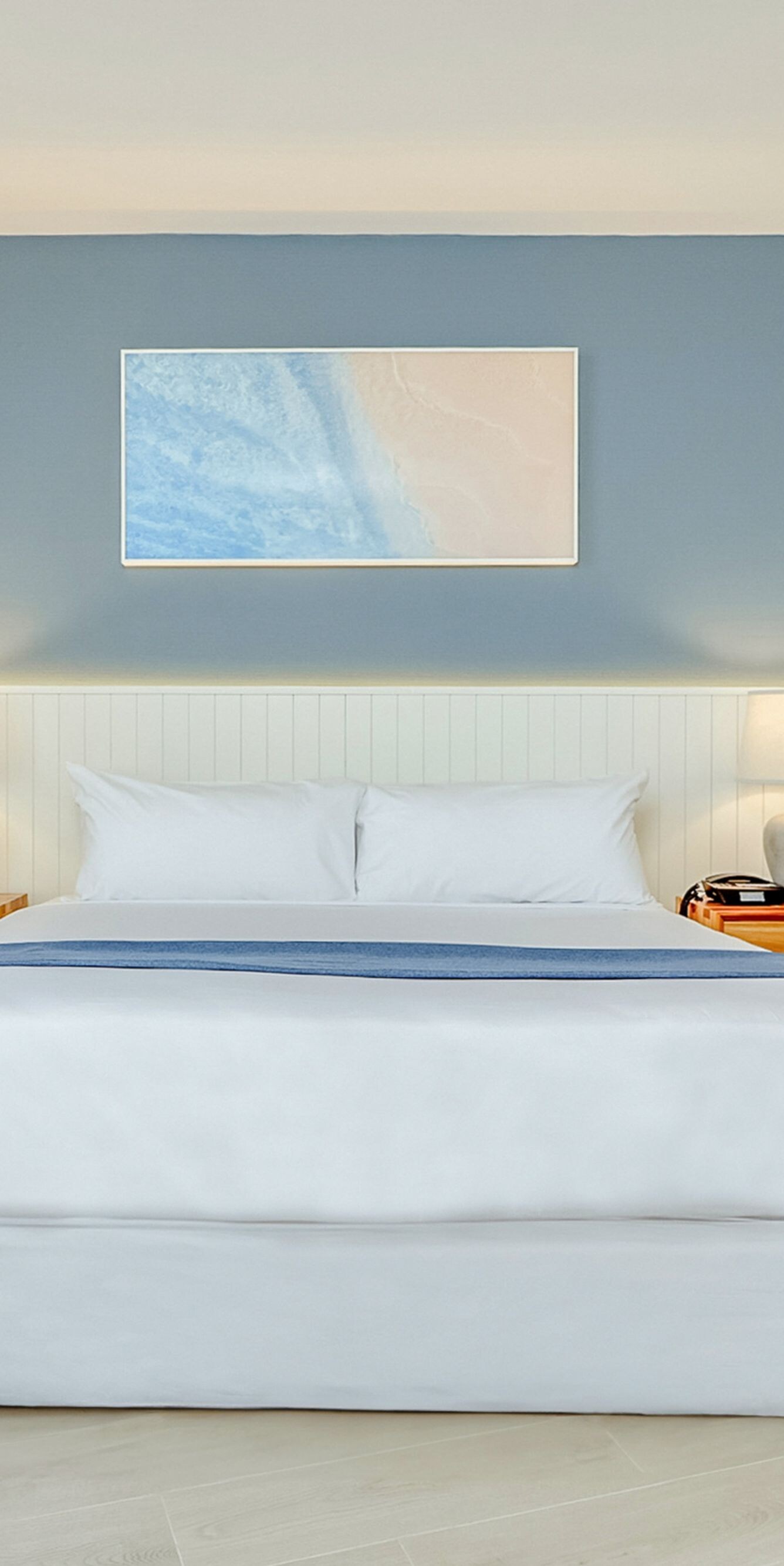 King bed with blue accent wall