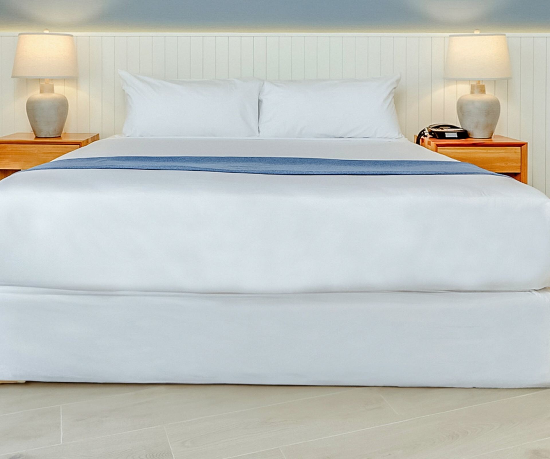 King bed with blue accent wall