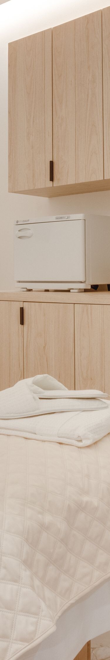Massage room with bed and plants