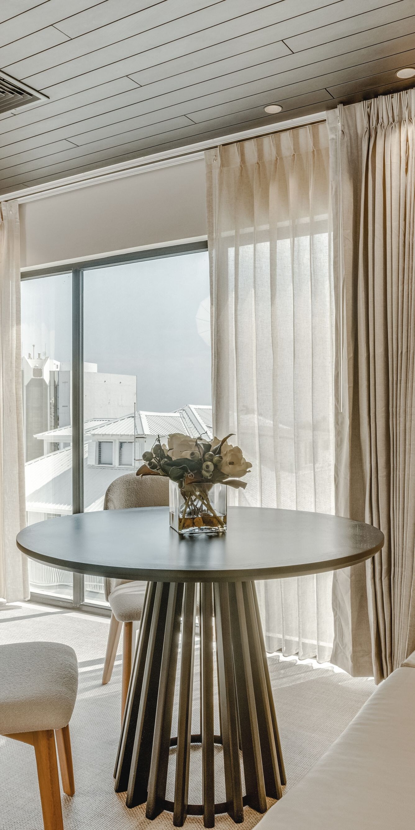 Small round table by window