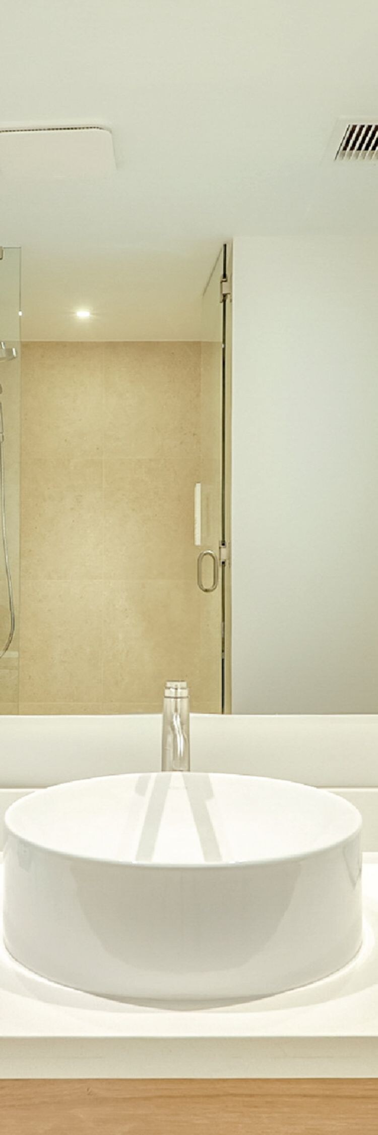 Bathroom with round sink and mirror