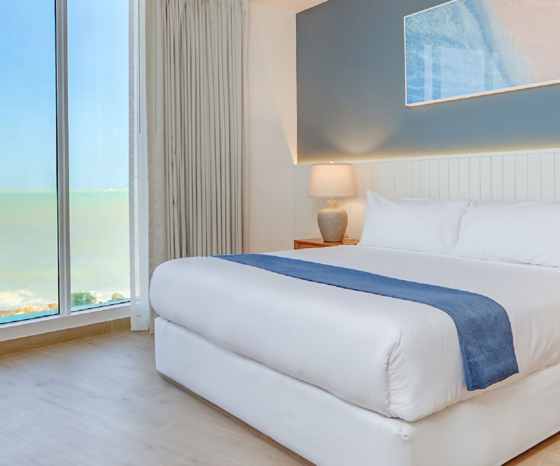 King bed with ocean view window