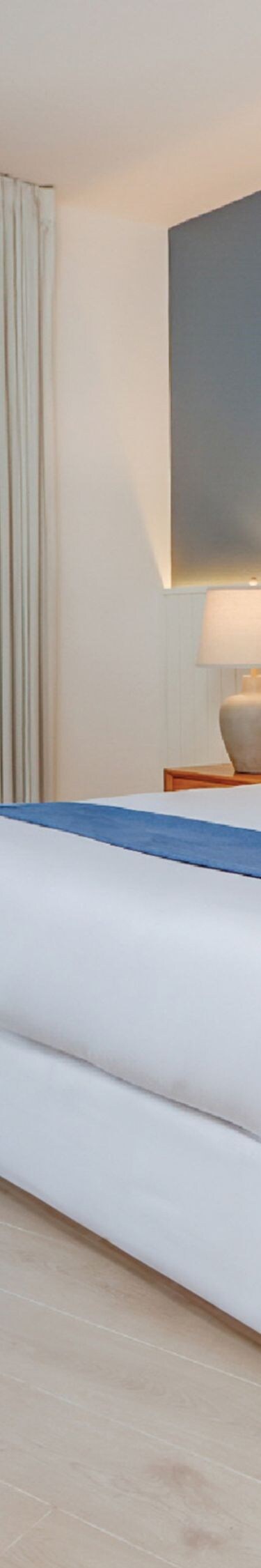 King bed with ocean view window