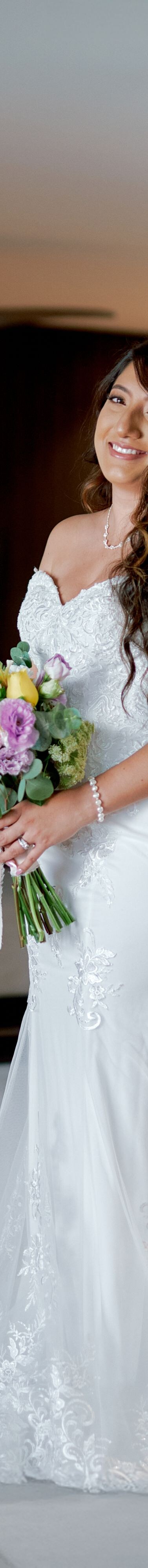  Person holding bouquet indoors