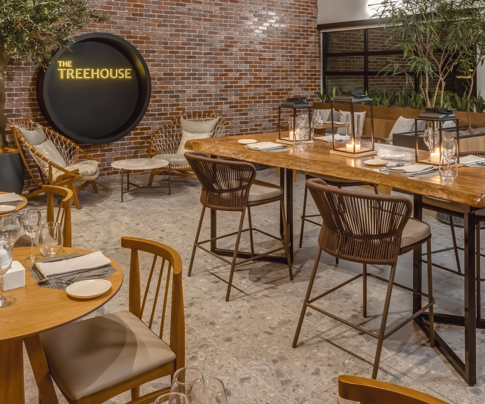 Indoor dining with warm lighting and plants