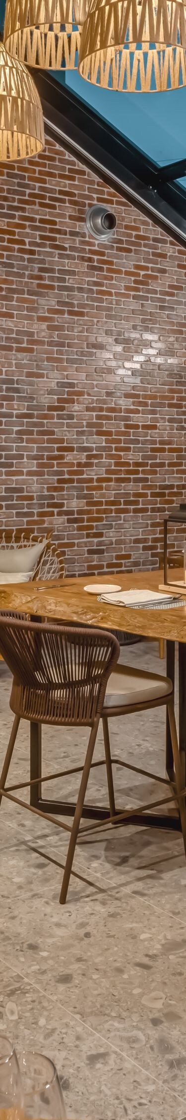 Indoor dining with warm lighting and plants