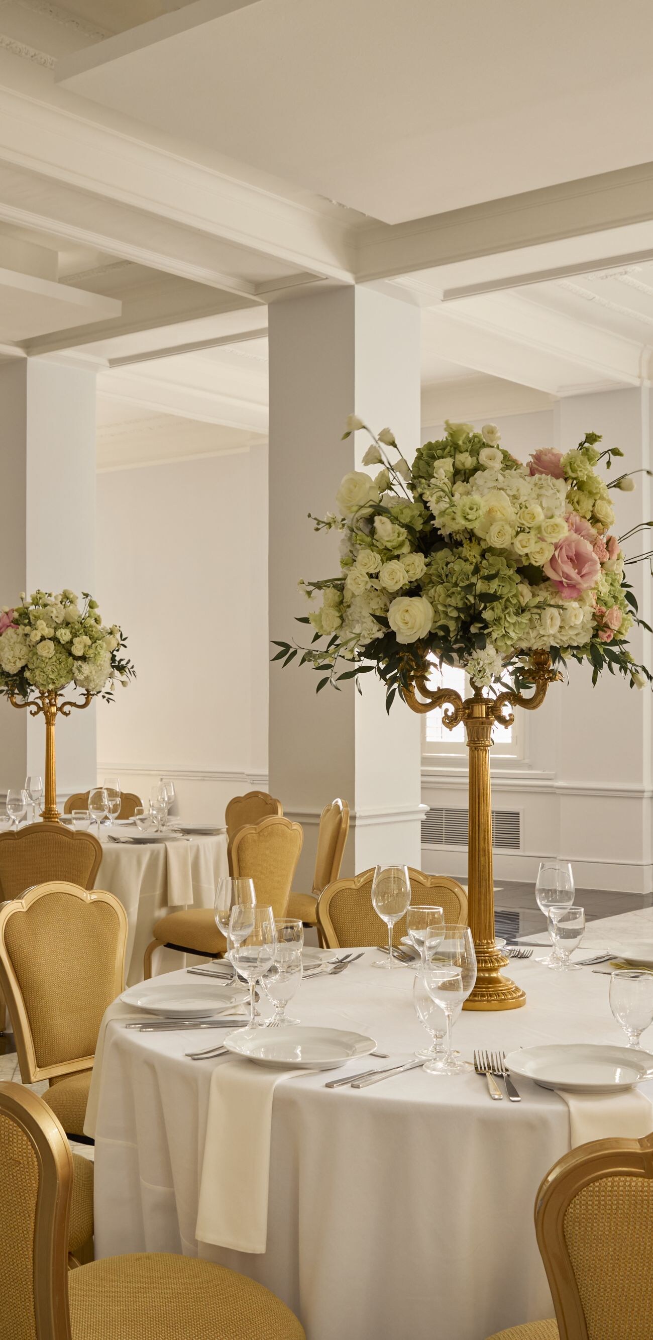 Elegant ballroom with floral centerpieces