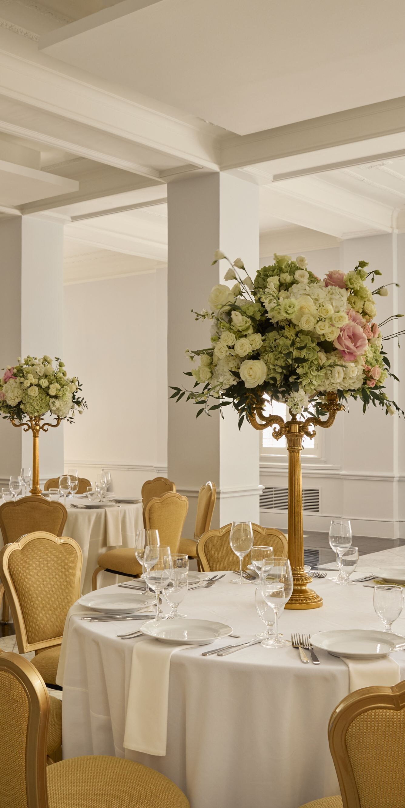 Elegant ballroom with floral centerpieces