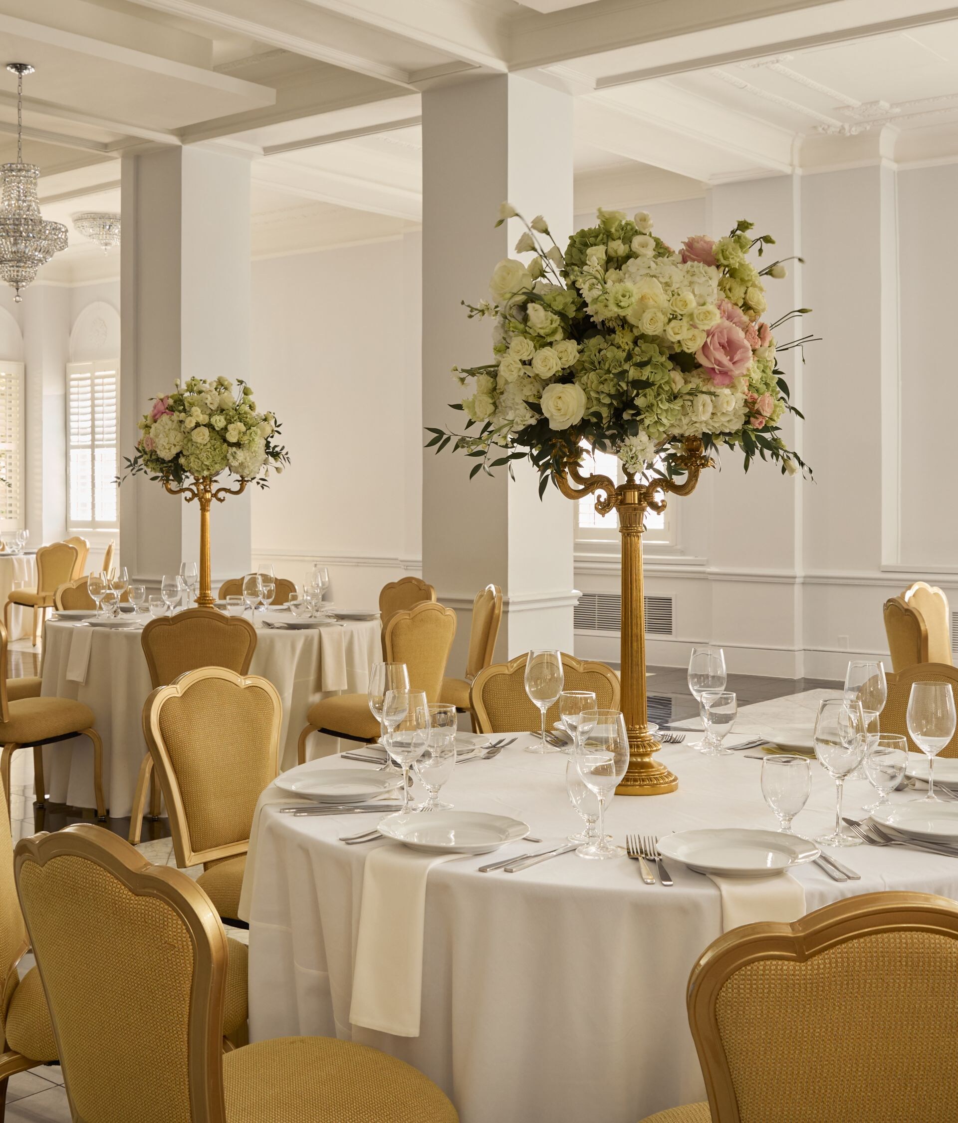 Elegant ballroom with floral centerpieces