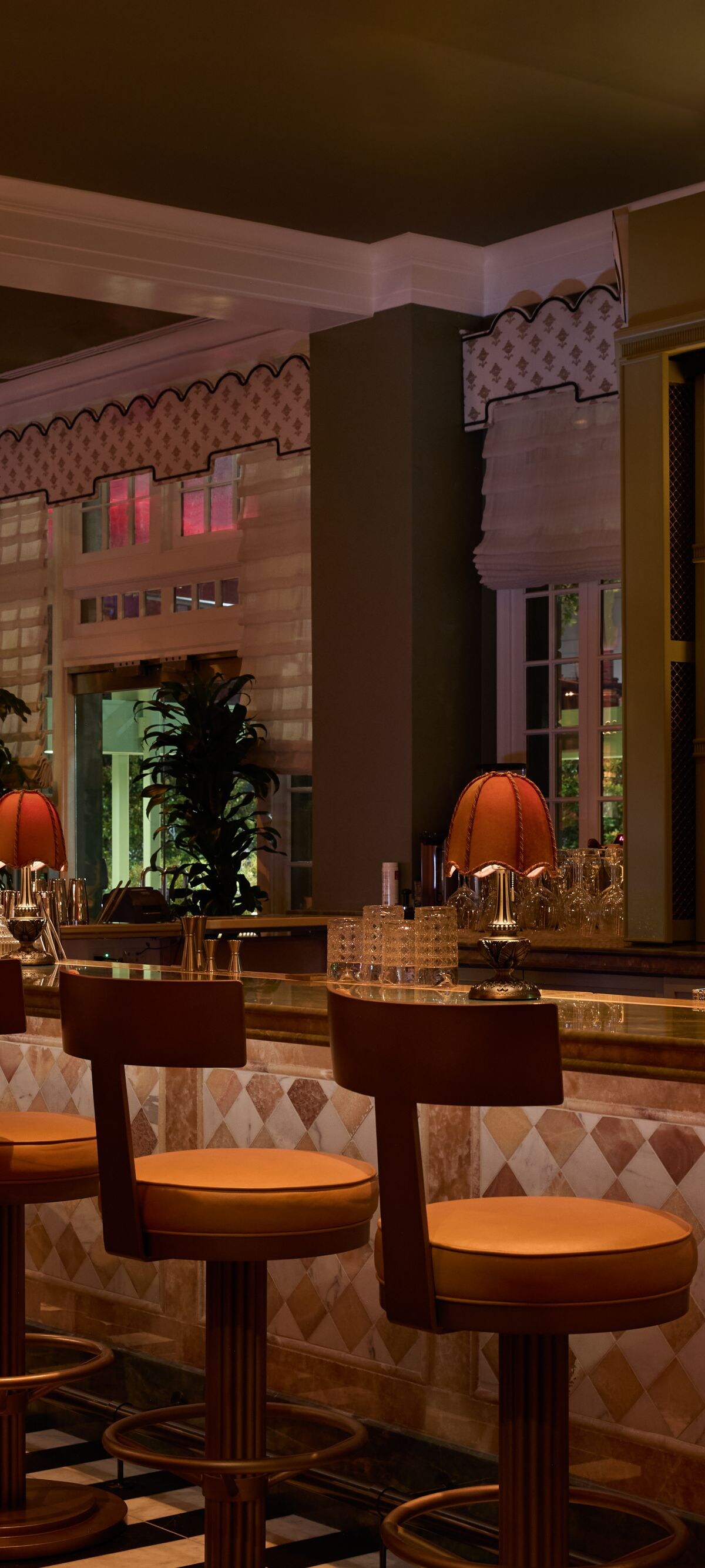Elegant bar with stools and warm lighting