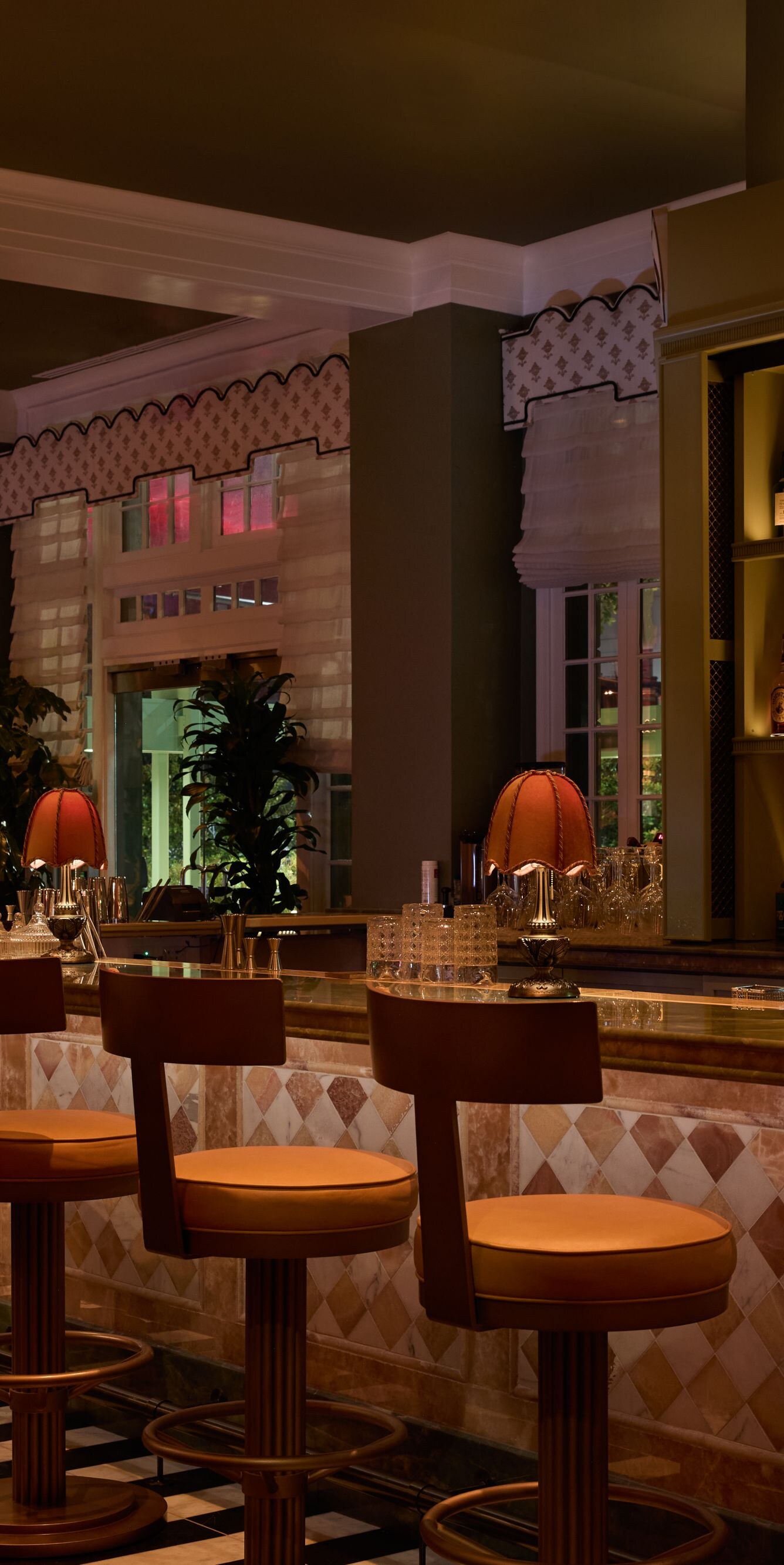 Elegant bar with stools and warm lighting