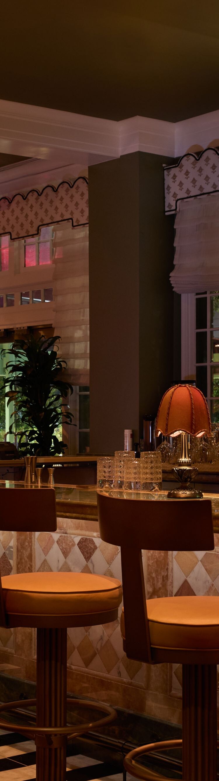 Elegant bar with stools and warm lighting