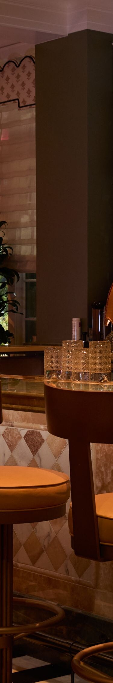 Elegant bar with stools and warm lighting