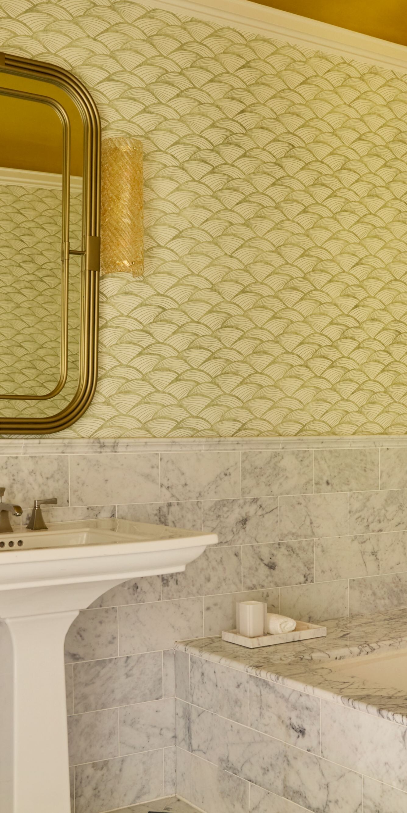 Marble bathroom with soaking tub and mirrors