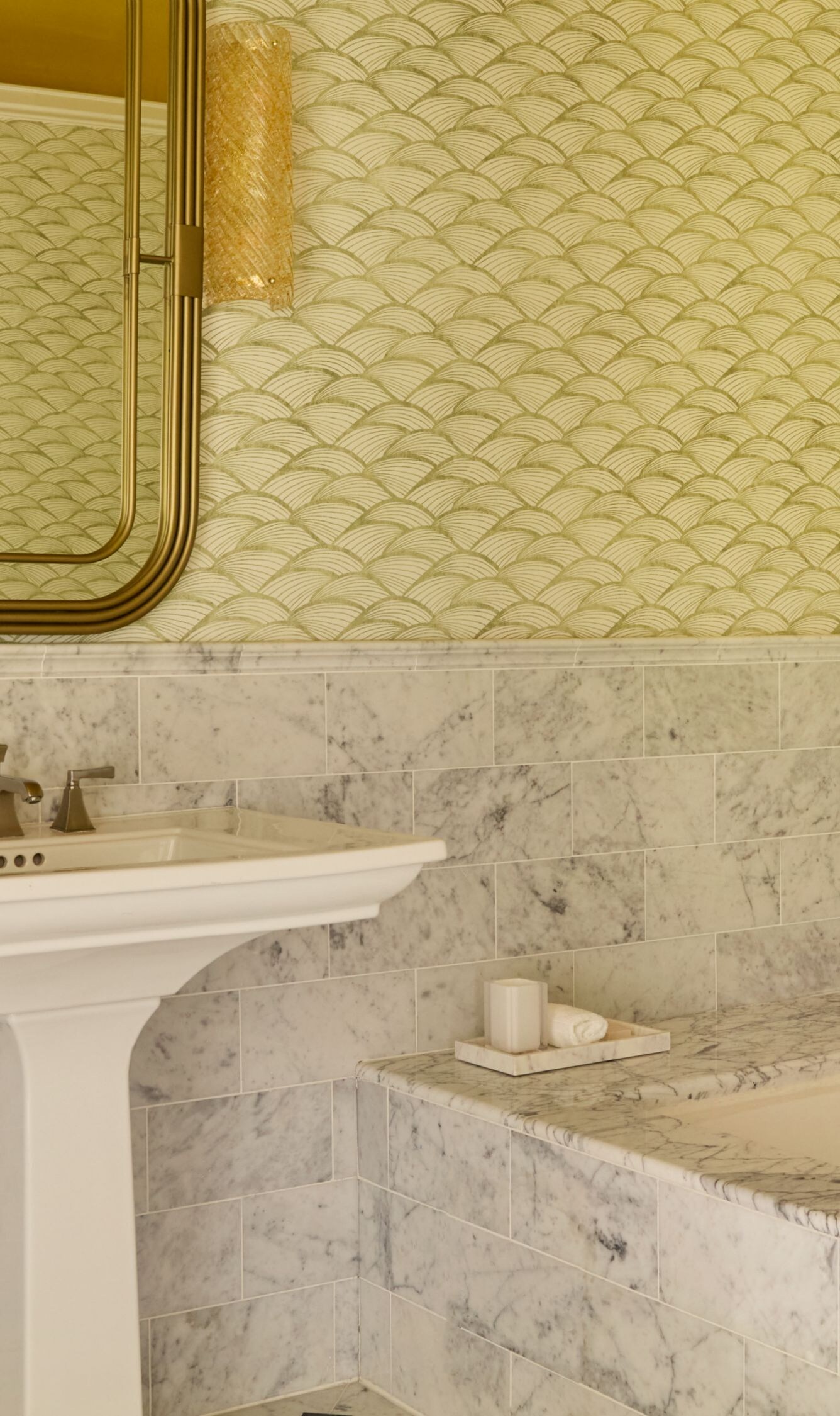 Marble bathroom with soaking tub and mirrors