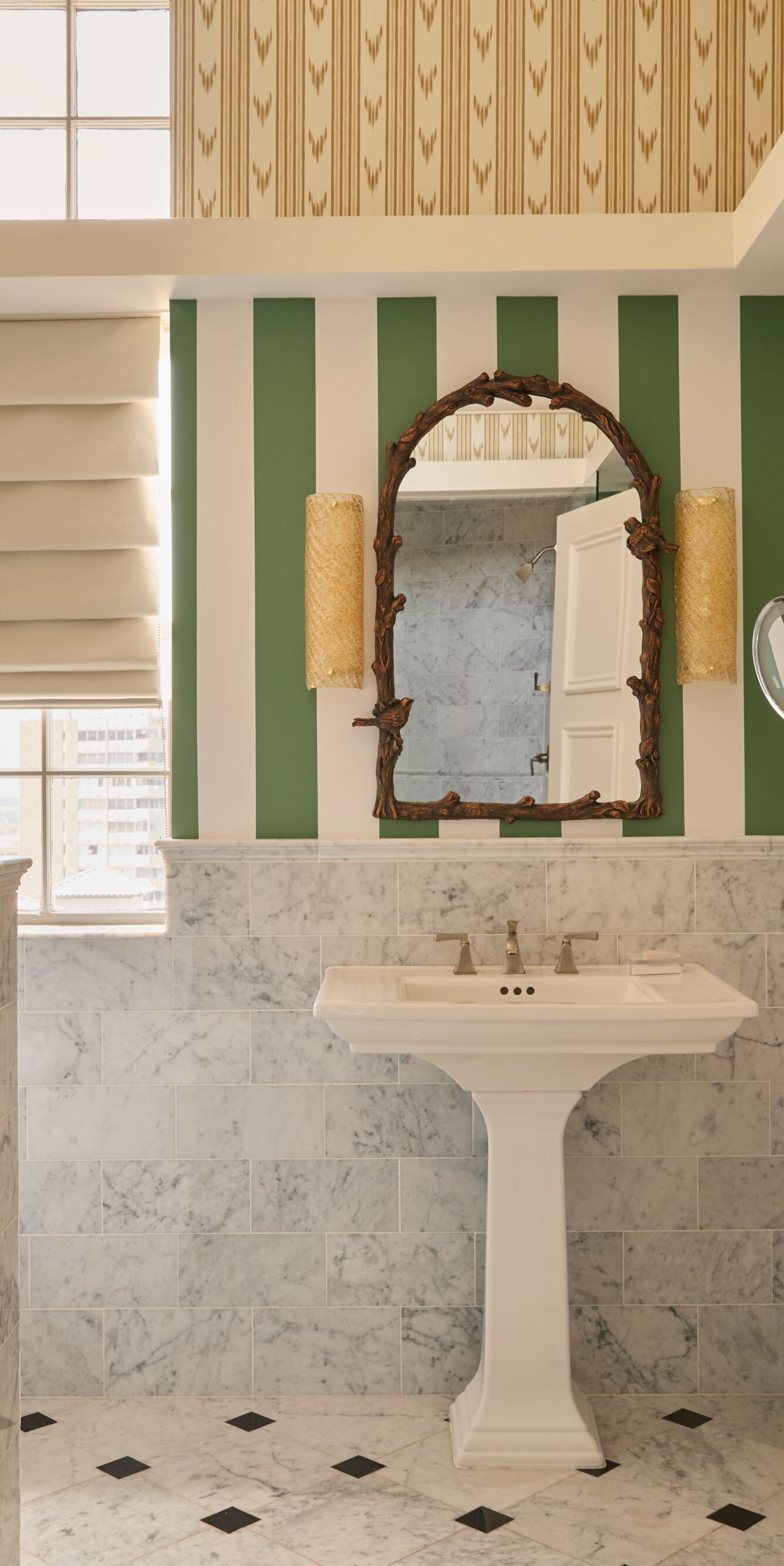 Marble bathroom with striped walls and sink