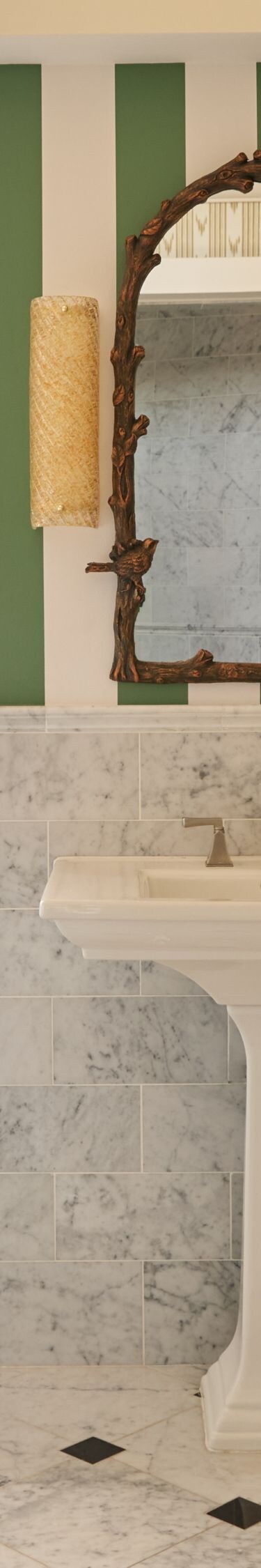 Marble bathroom with striped walls and sink