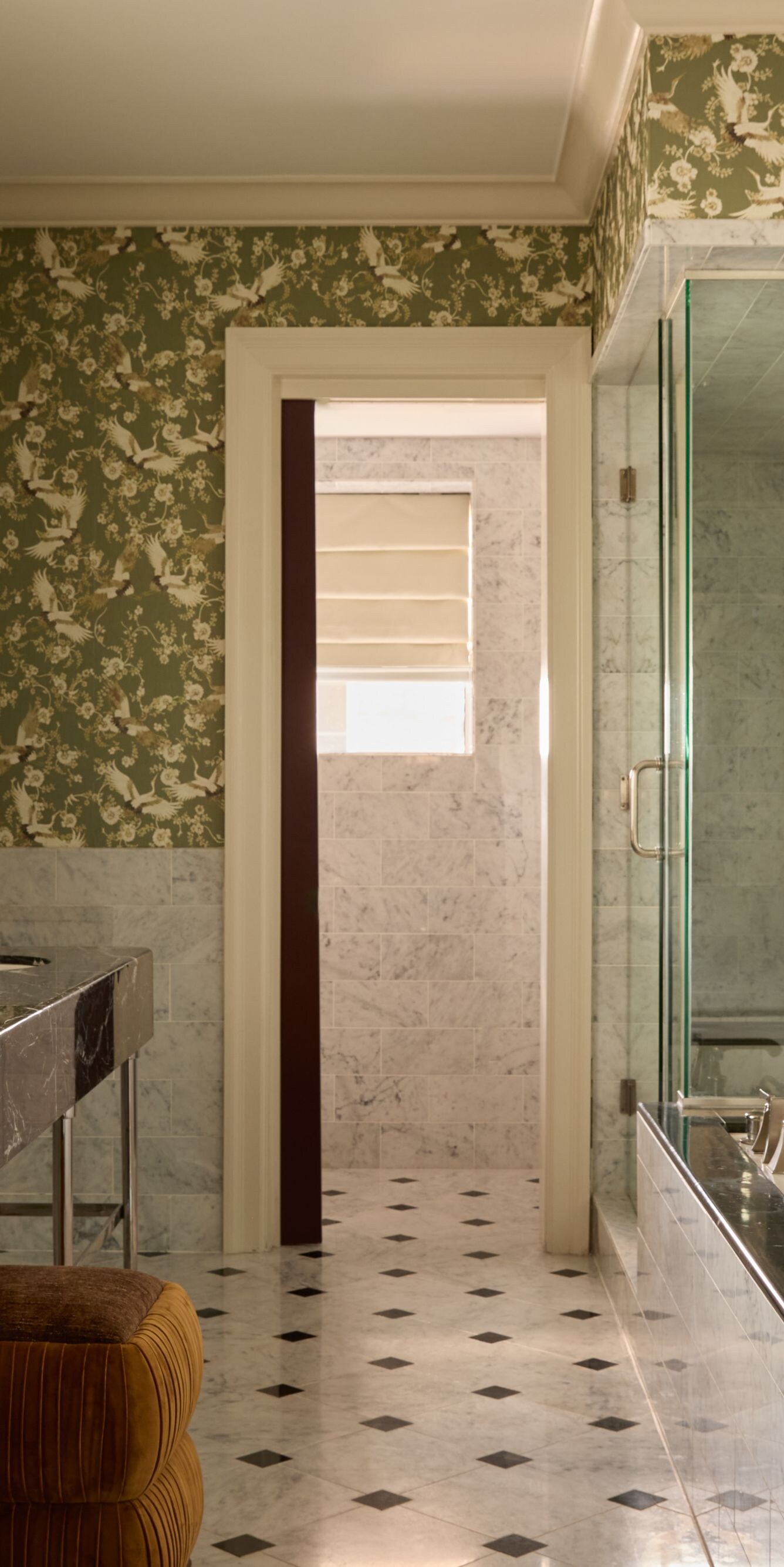 Marble bathroom with dual sinks and glass shower