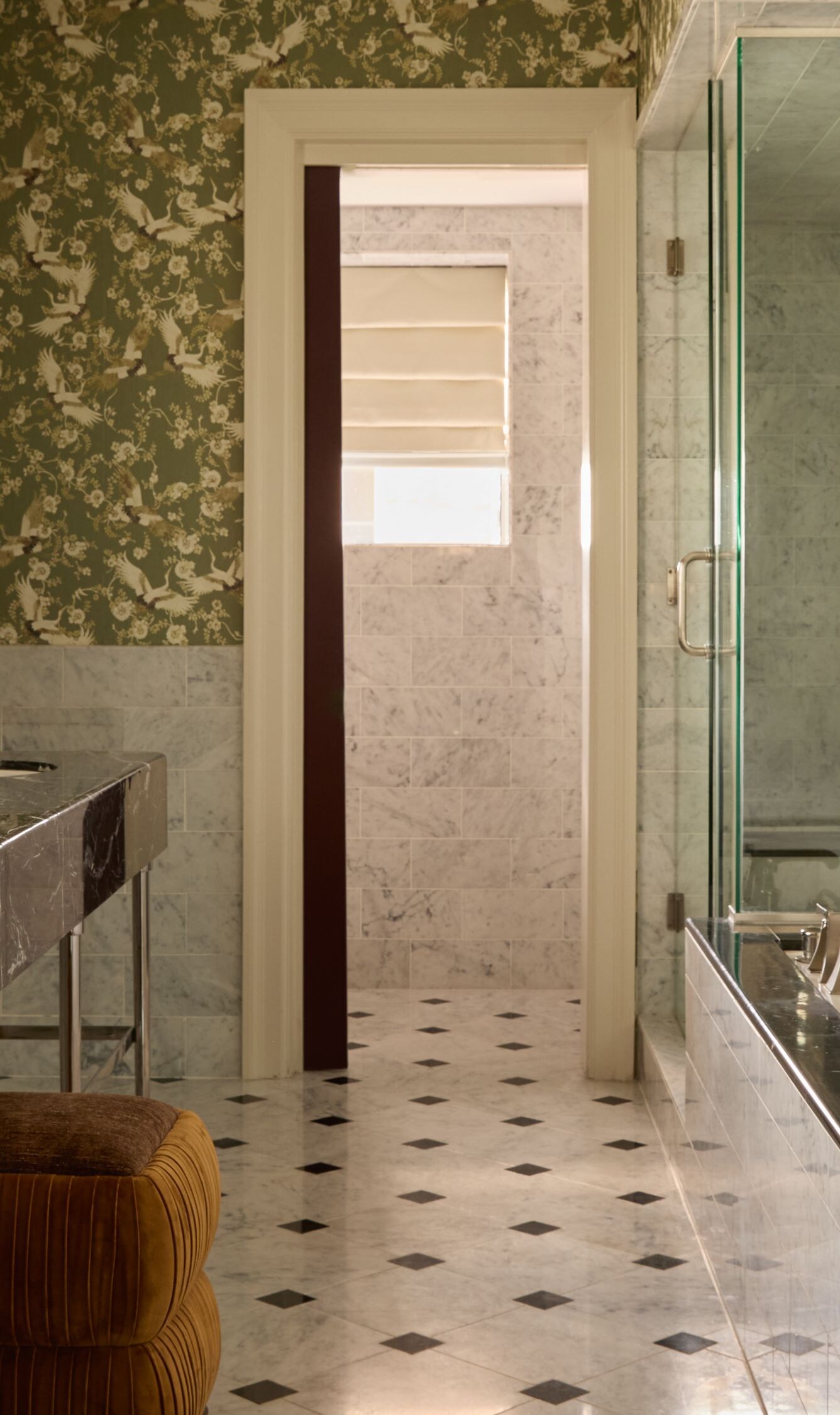 Marble bathroom with dual sinks and glass shower
