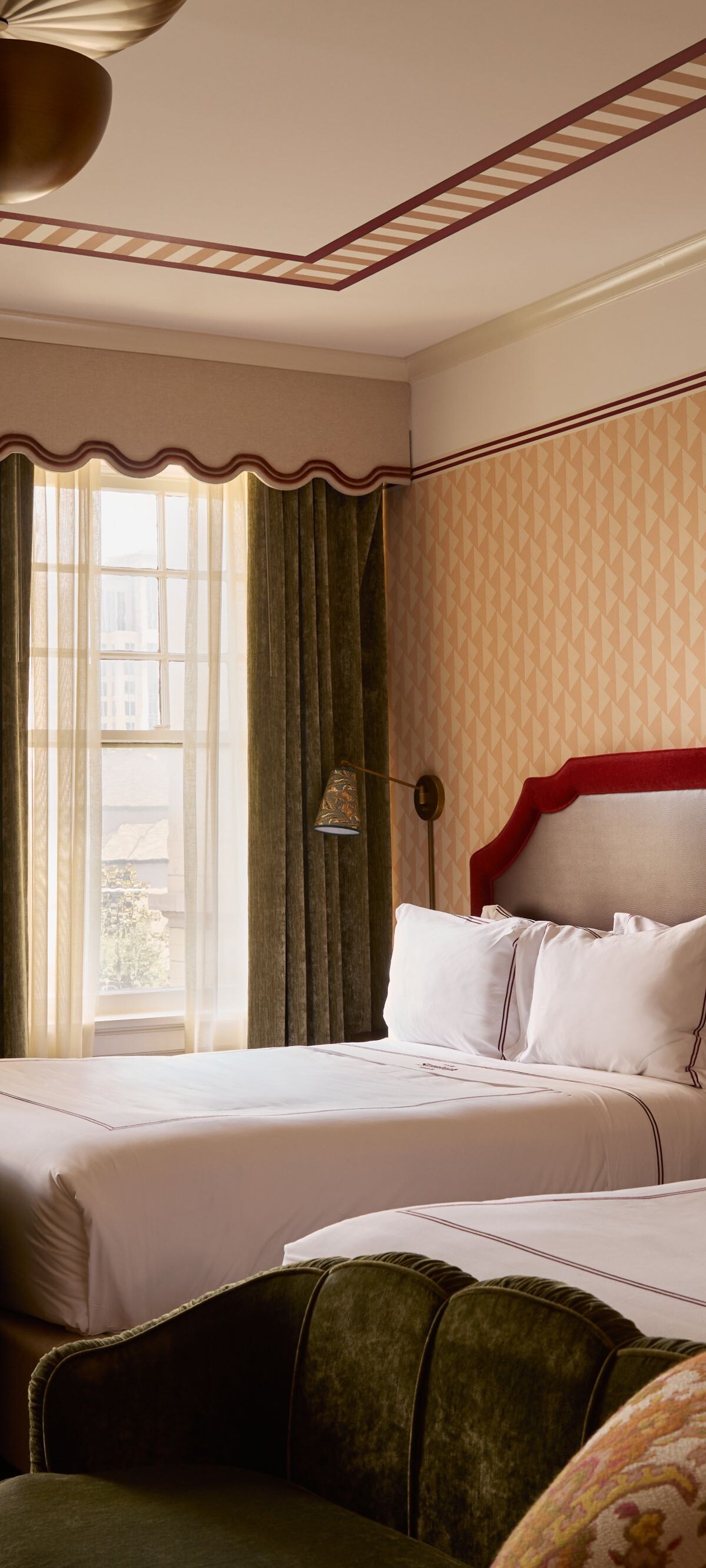 Guest room with two queen beds & lounge chairs