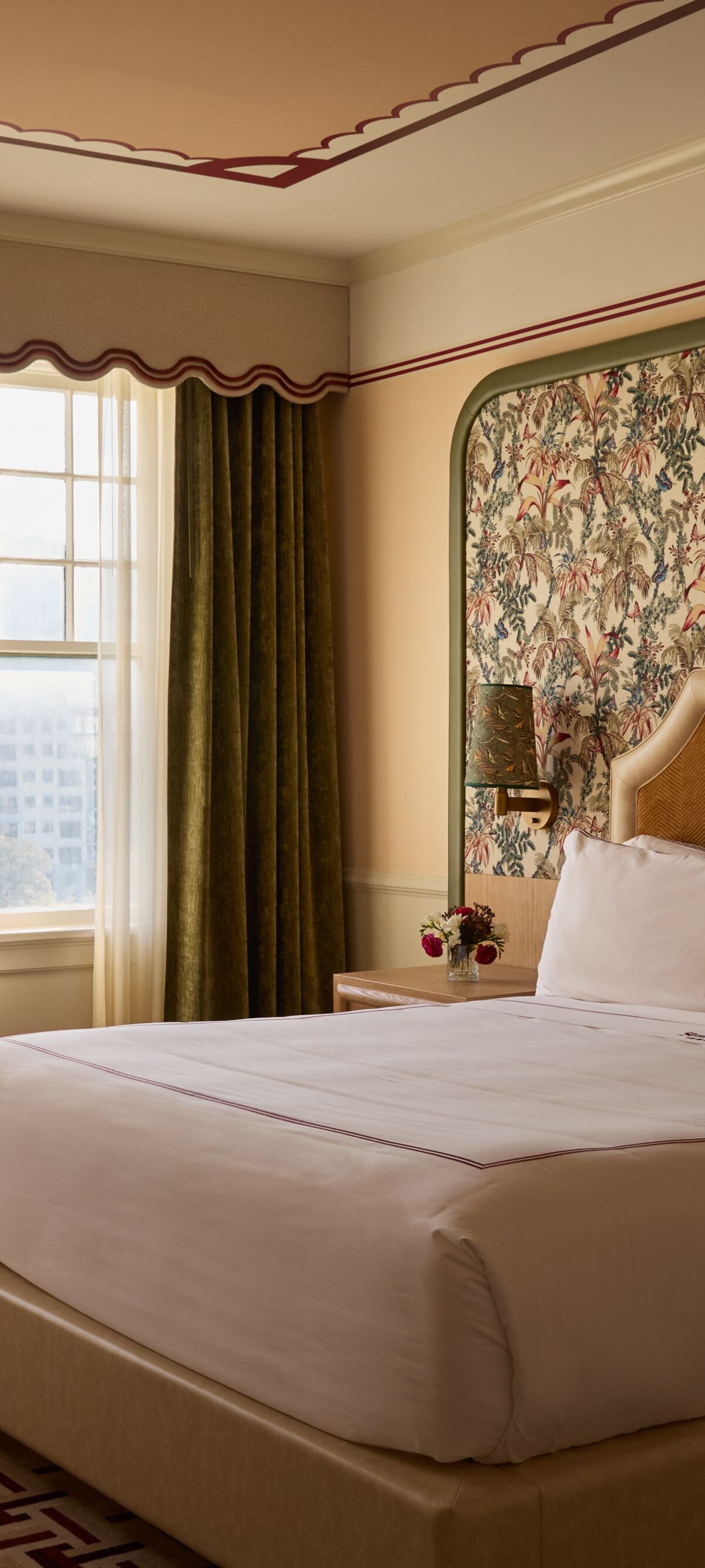 Guest room with king bed and upholstered chair