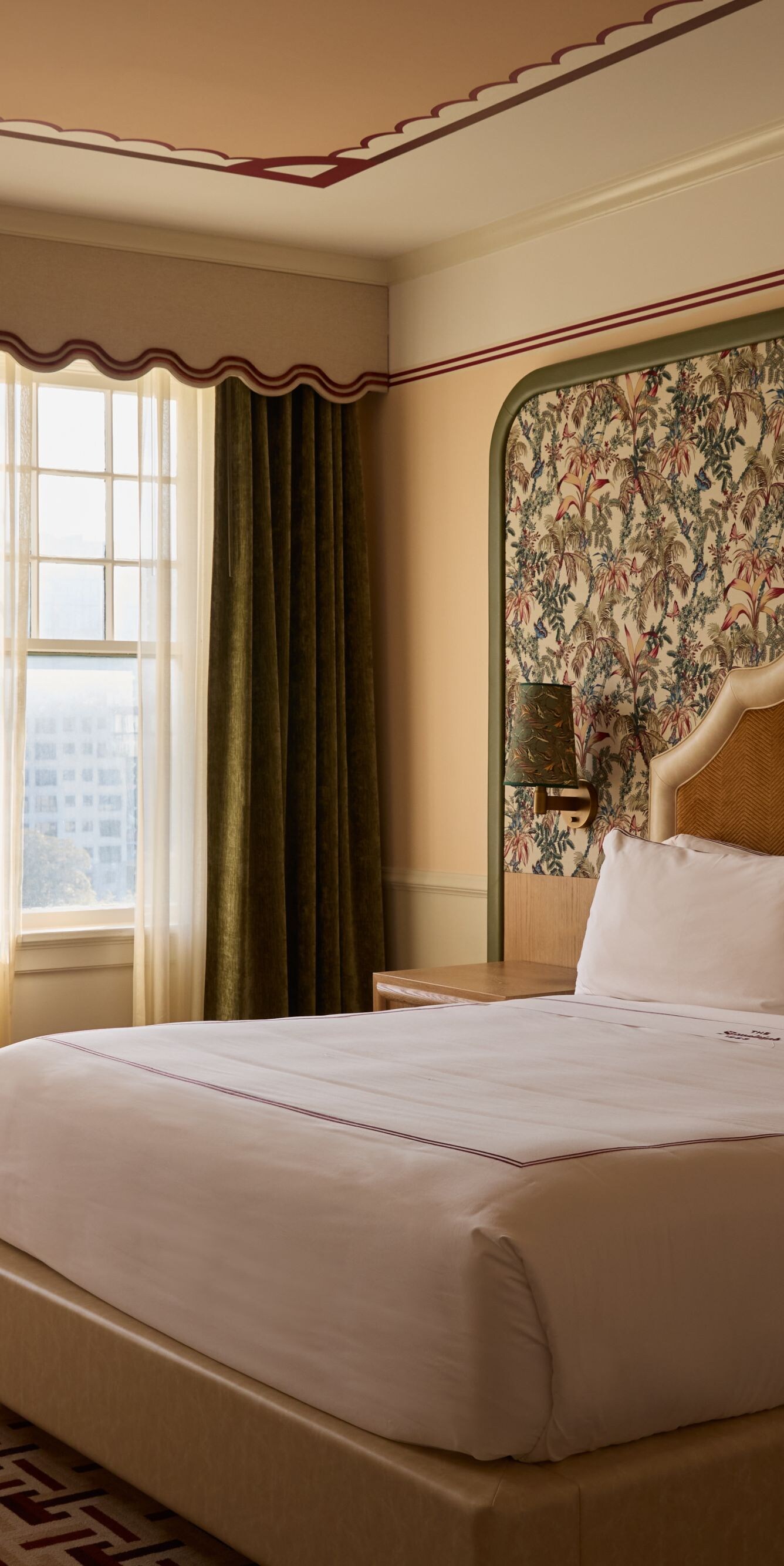 King guest room with floral wallcovering