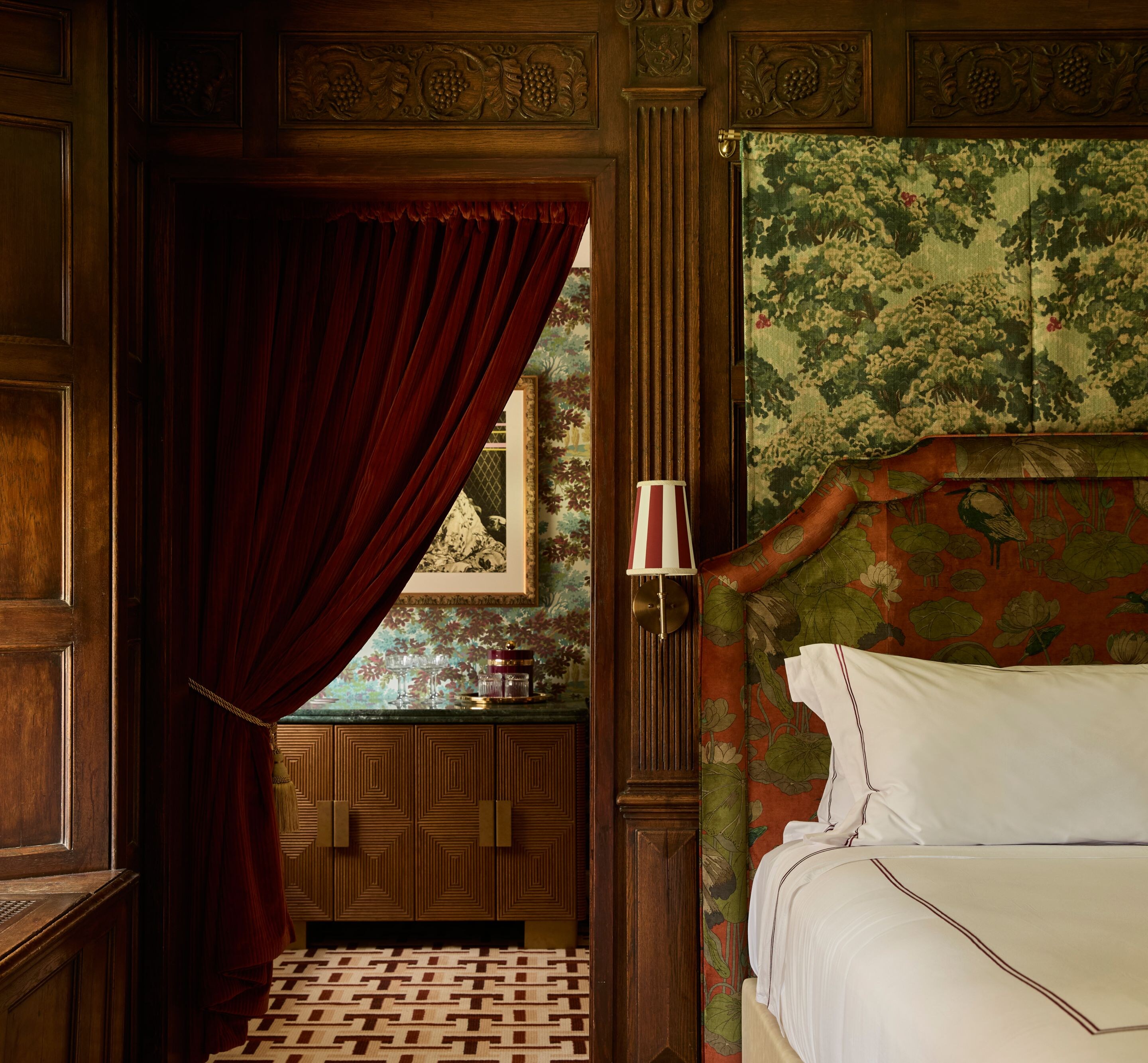Bedroom with patterned headboard and wood accents