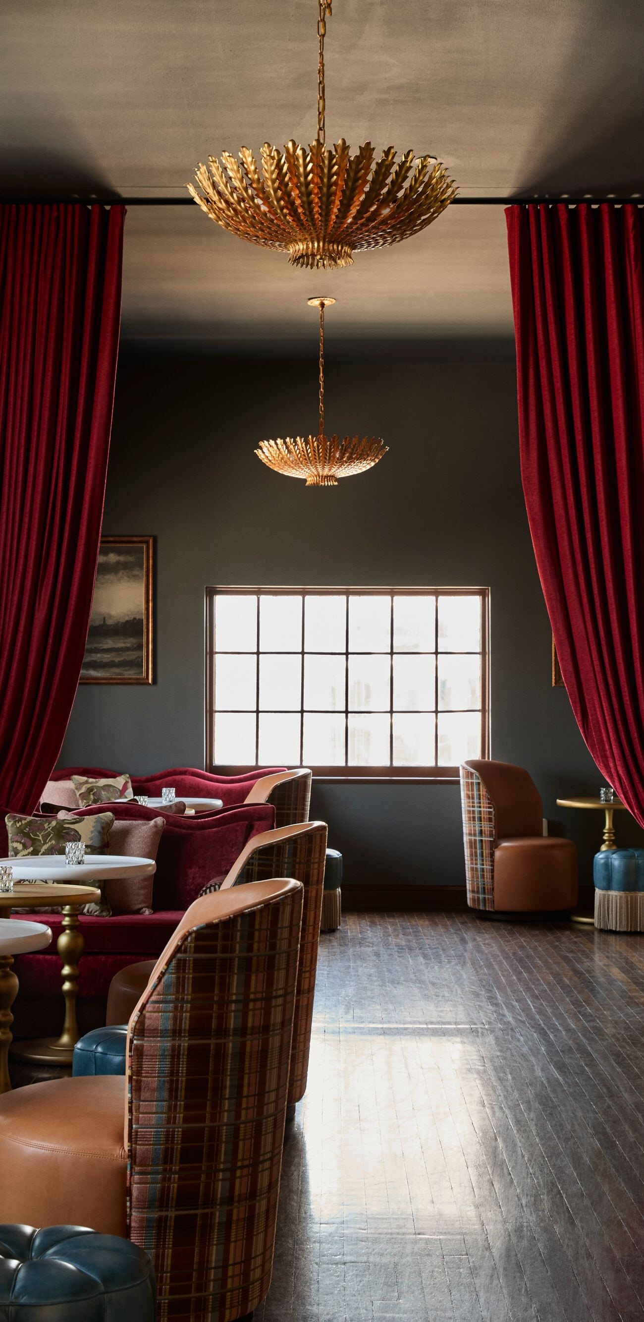 Sophisticated lounge with red drapes and seating