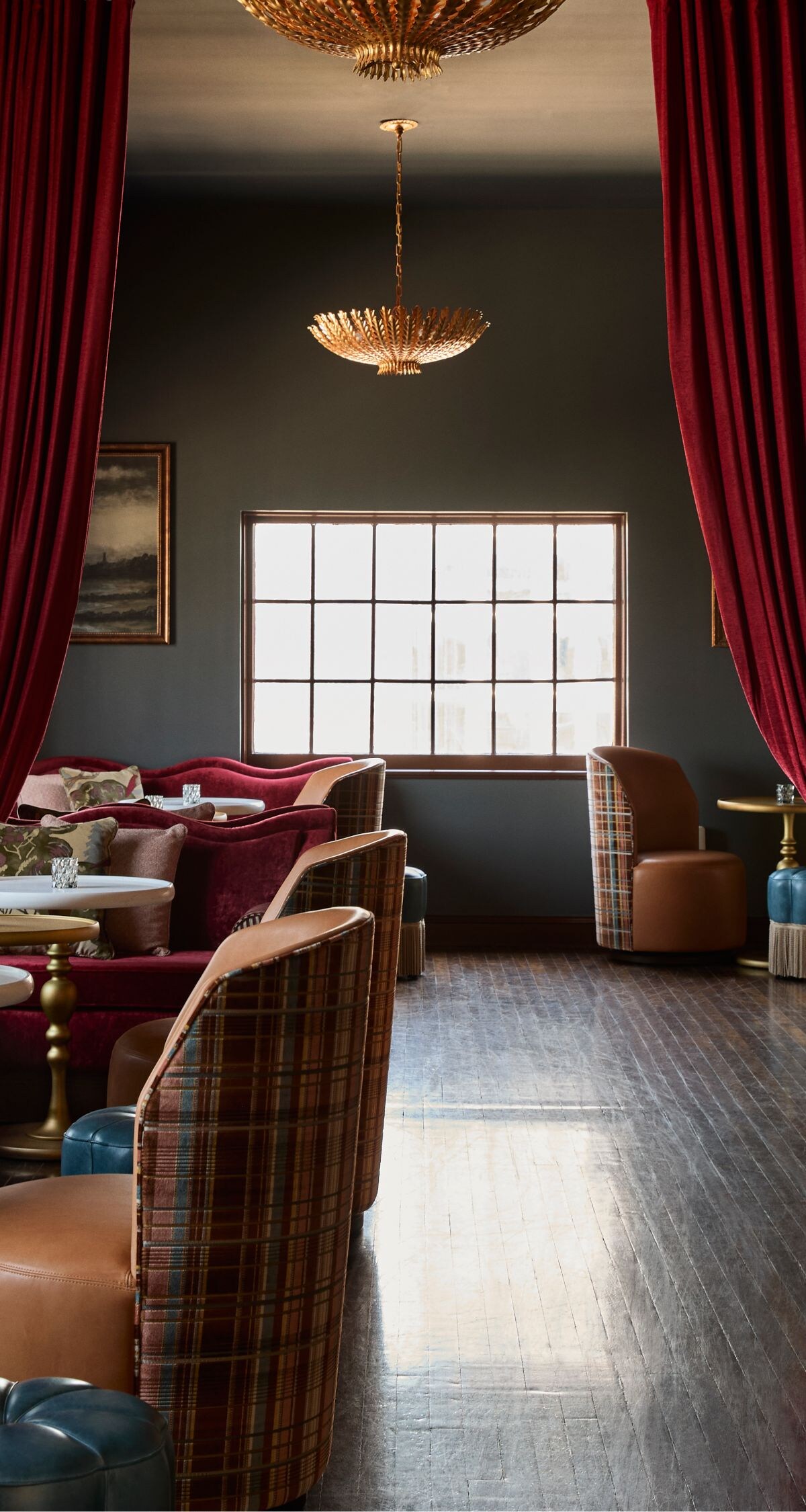 Sophisticated lounge with red drapes and seating