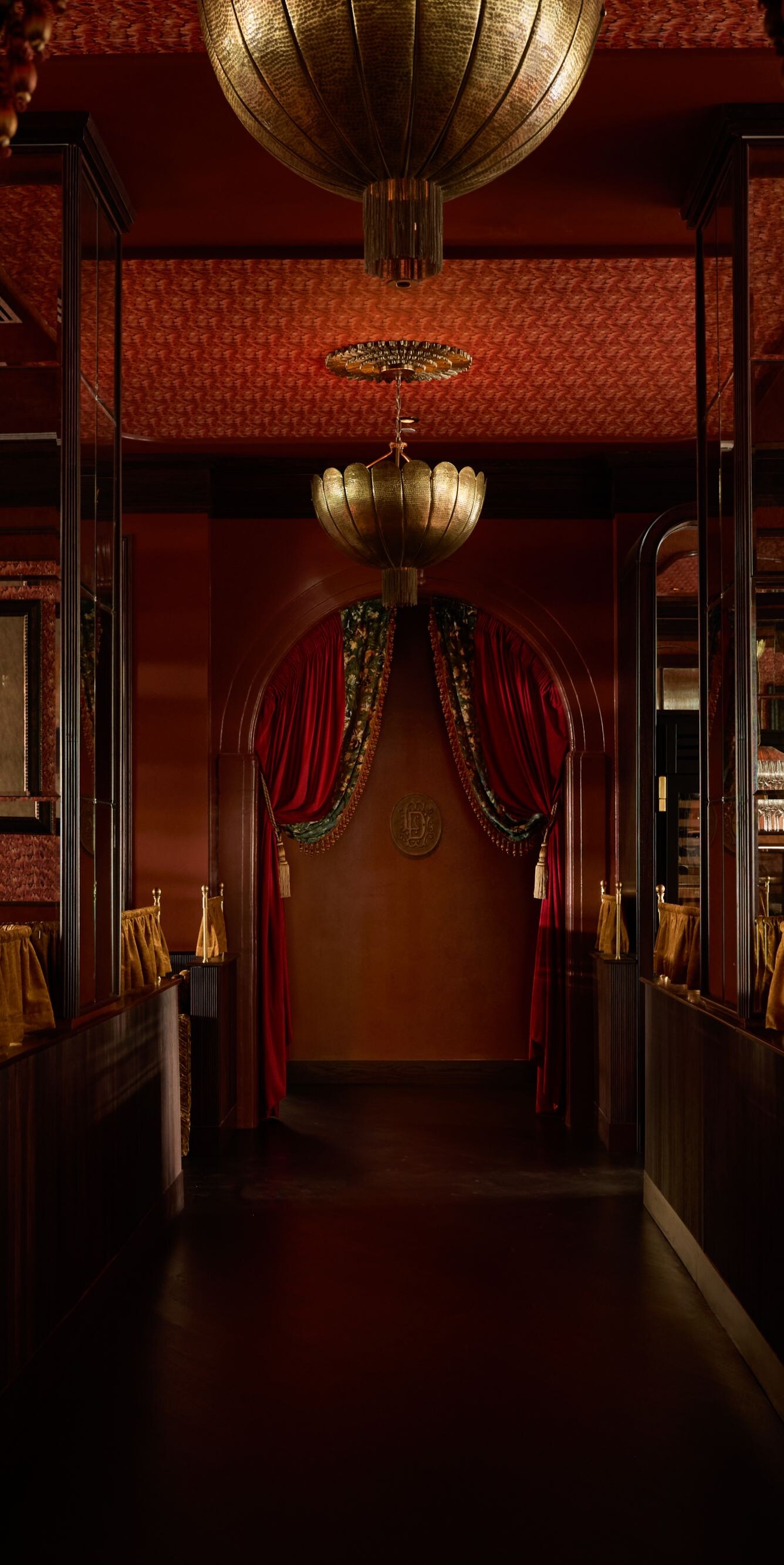 Dining room with velvet drapes and booths