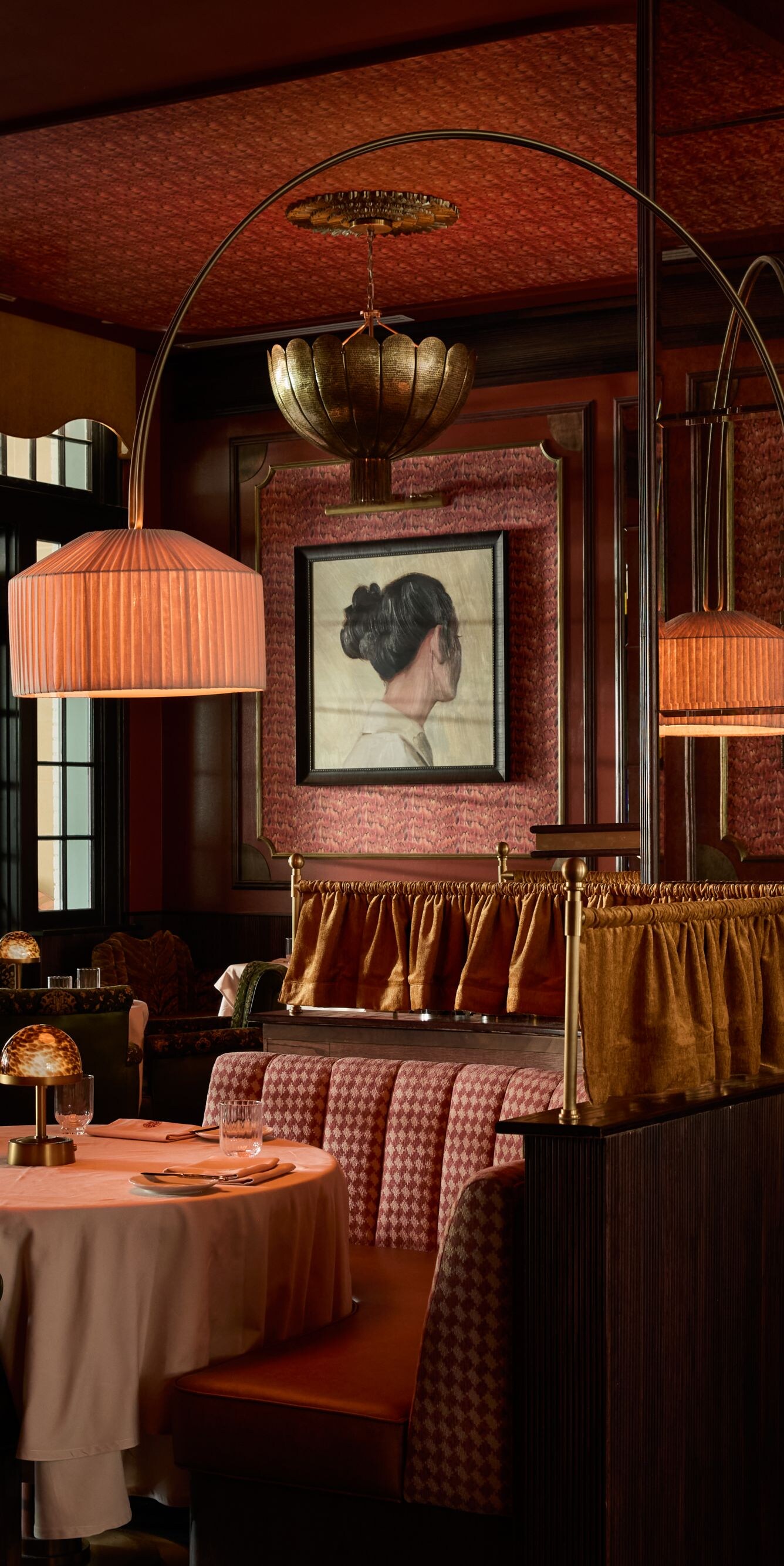 Elegant dining room with booths and warm décor