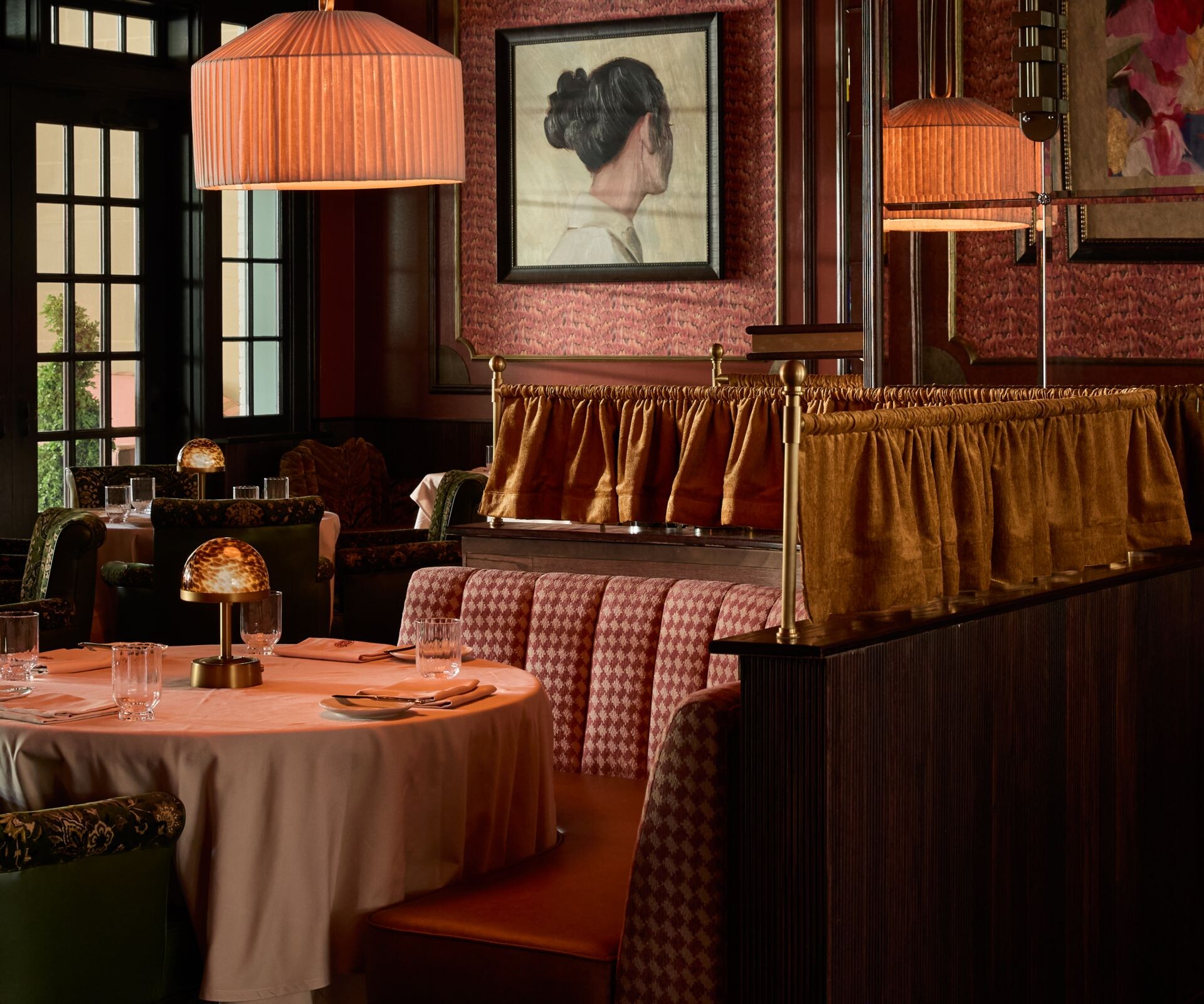 Elegant dining room with booths and warm décor