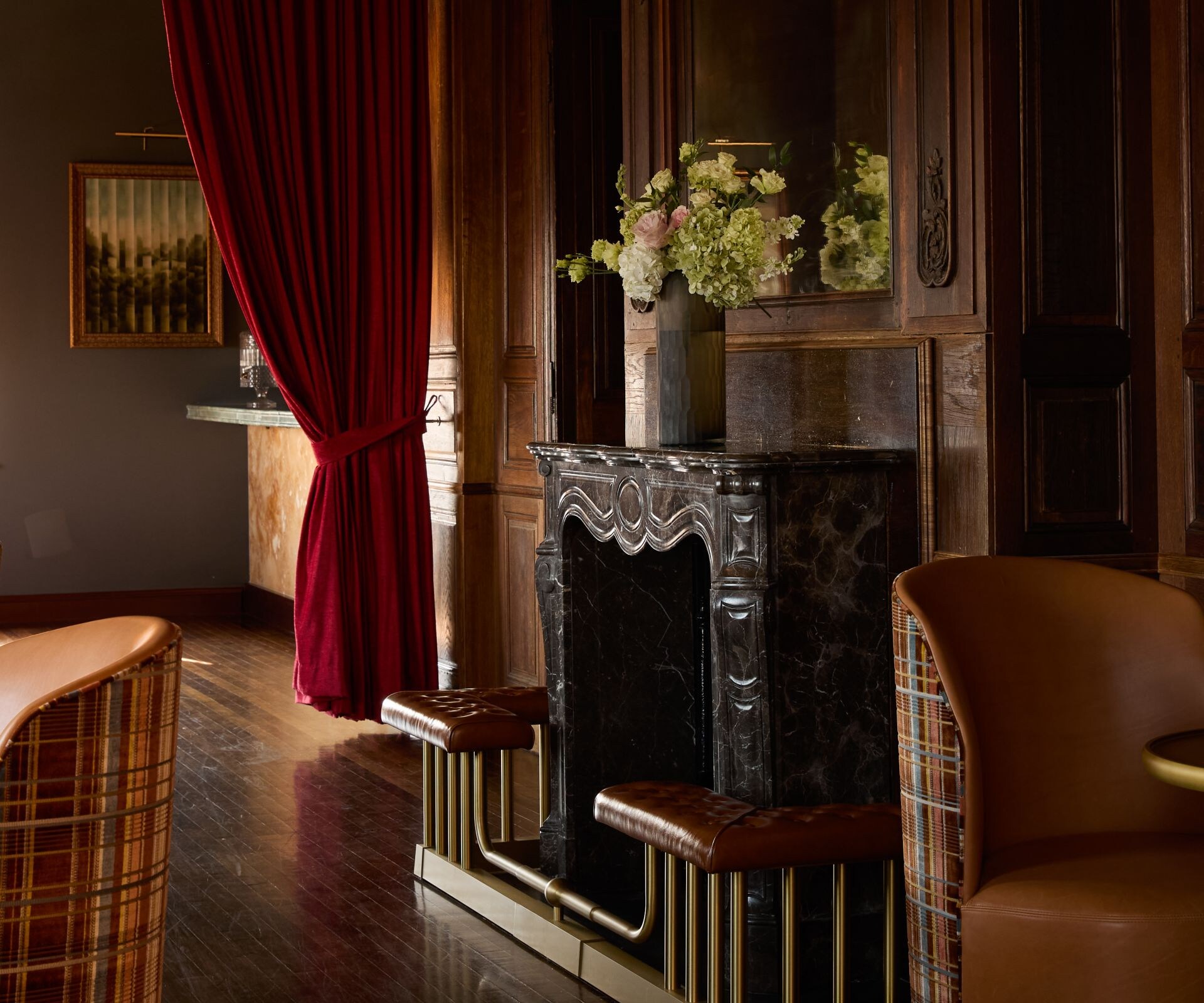 Elegant lounge with fireplace and velvet drapes