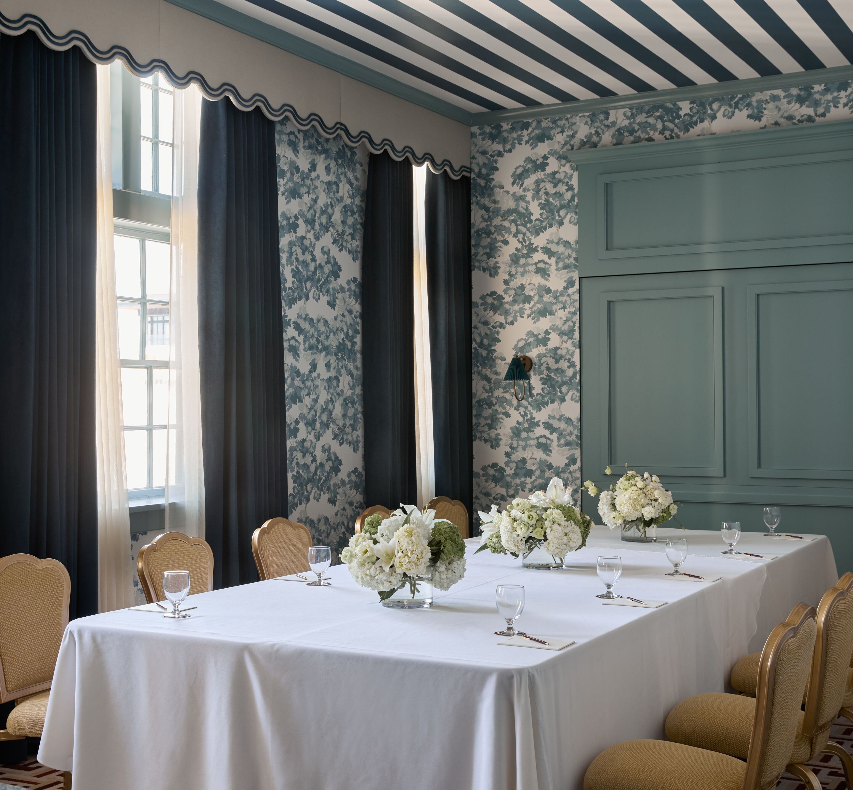 Private meeting room with floral décor and tables