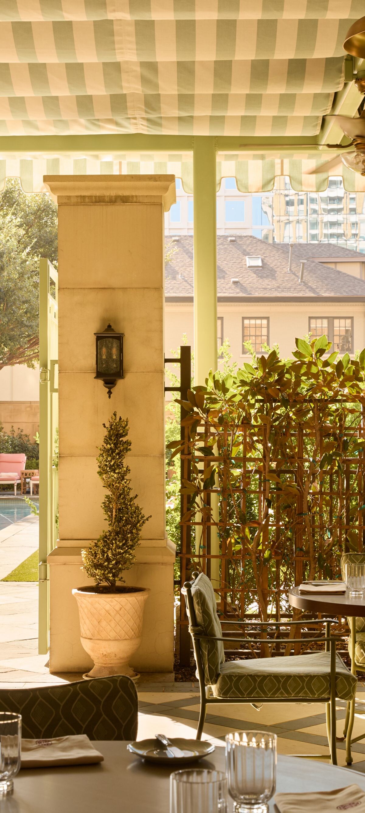 Covered patio dining overlooking the pool area