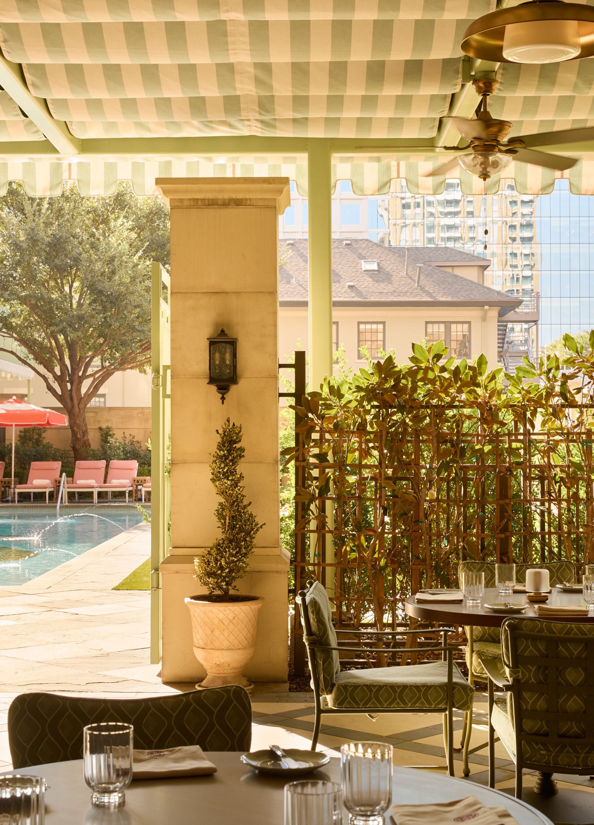 Covered patio dining overlooking the pool area