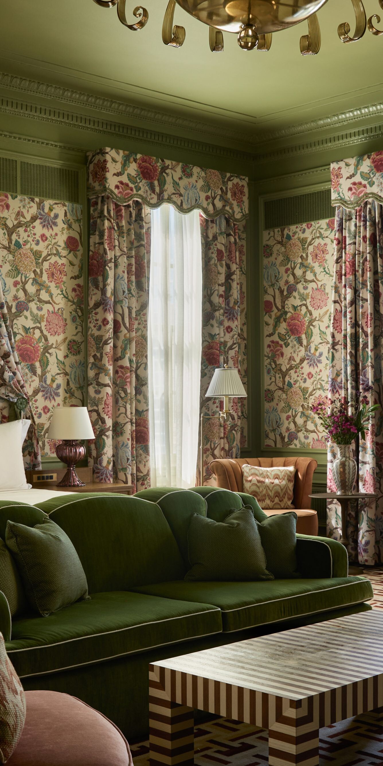 Spacious suite with floral décor and seating area